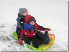 The boys testing out the sled